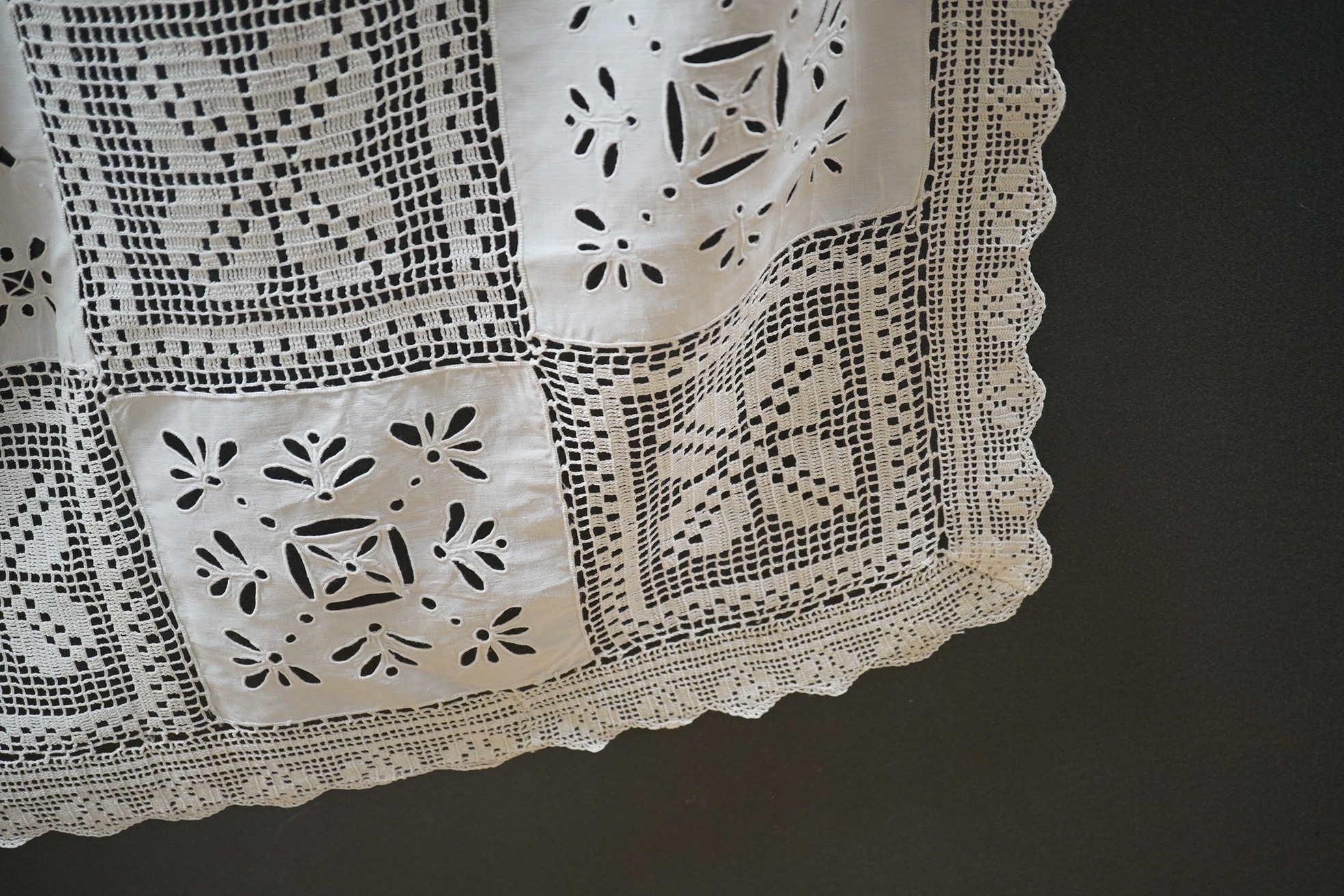 A fancy crochet and anglaise hand worked tablecloth, together with a collection of lawn and linen table linen, mats, etc. and various lengths of lace including a panel of Irish crochet, Irish crochet panel 142cm long x 5